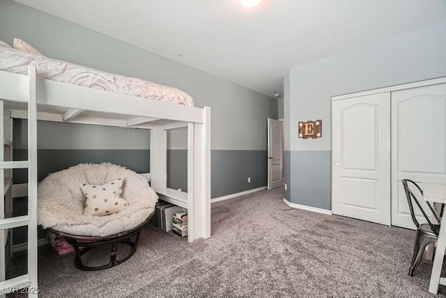 bedroom featuring baseboards, carpet, and a closet