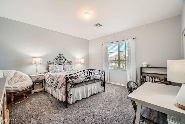 bedroom with baseboards, visible vents, and carpet