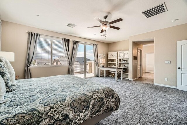 carpeted bedroom featuring visible vents, baseboards, ceiling fan, and access to outside
