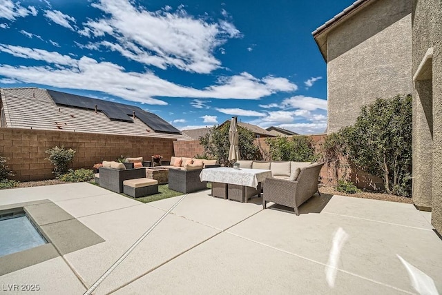 view of patio / terrace with an outdoor living space and a fenced backyard
