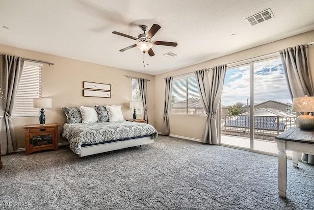 carpeted bedroom featuring baseboards, access to outside, ceiling fan, and visible vents