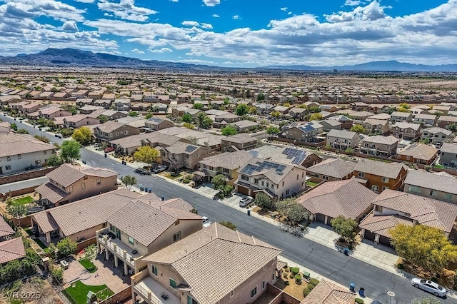 drone / aerial view featuring a residential view and a mountain view