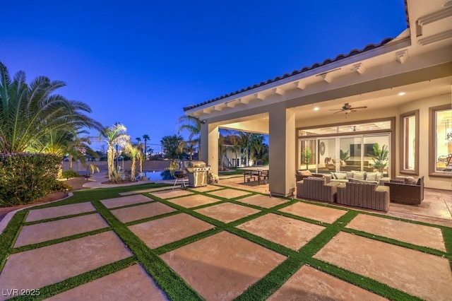 view of patio / terrace with an outdoor hangout area, a ceiling fan, and a grill