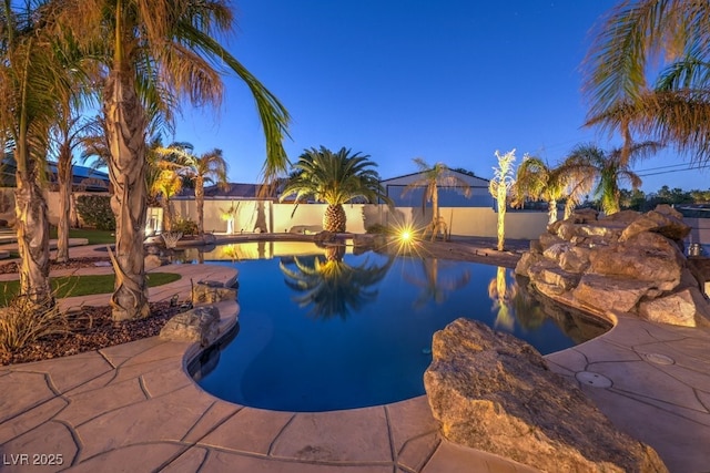view of pool featuring a fenced in pool, a fenced backyard, and a patio area