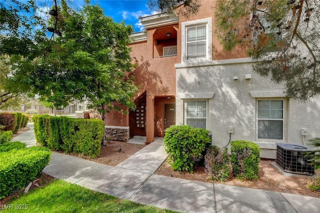 9303 Gilcrease Ave Unit 1245, Las Vegas, NV 89149 - view of front of home with central AC and stucco siding