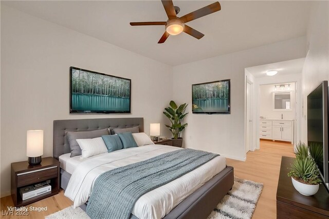 9303 Gilcrease Ave Unit 1245, Las Vegas, NV 89149 - bedroom featuring ensuite bath, light wood-style floors, and ceiling fan