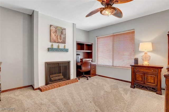 5019 Lancaster Dr, Las Vegas, NV 89120 - home office with baseboards, a ceiling fan, carpet flooring, and a fireplace
