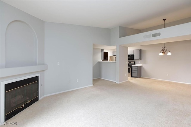unfurnished living room with light colored carpet, baseboards, visible vents, and an inviting chandelier