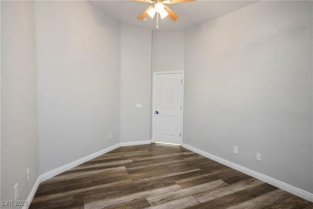 8504 W Gilmore Ave, Las Vegas, NV 89129 - unfurnished room with ceiling fan, baseboards, and dark wood-type flooring