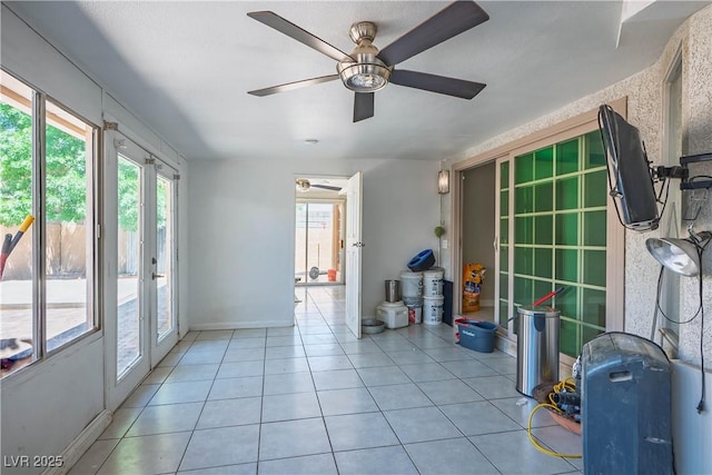 8504 W Gilmore Ave, Las Vegas, NV 89129 - unfurnished room featuring plenty of natural light, a ceiling fan, french doors, and light tile patterned flooring
