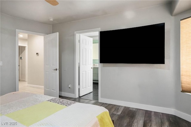 8504 W Gilmore Ave, Las Vegas, NV 89129 - bedroom featuring baseboards and wood finished floors