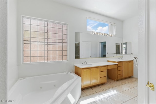 full bath with tile patterned flooring, double vanity, a high ceiling, a whirlpool tub, and a sink