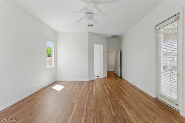 unfurnished bedroom with visible vents, access to exterior, and light wood-style floors