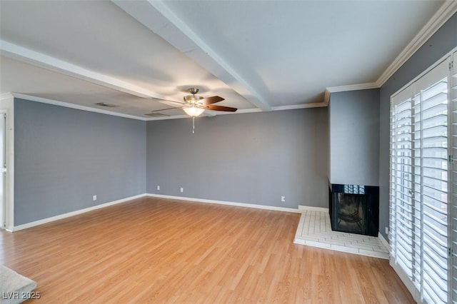 516 Delfern Ln, Las Vegas, NV 89169 - unfurnished living room with ceiling fan, a multi sided fireplace, wood finished floors, baseboards, and beam ceiling