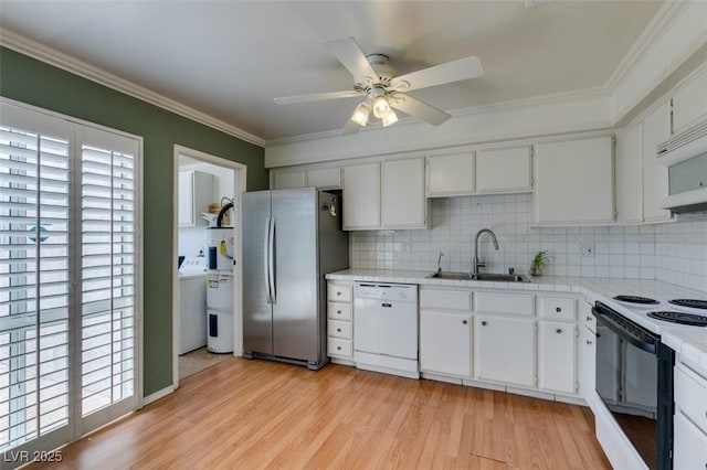 516 Delfern Ln, Las Vegas, NV 89169 - kitchen with white appliances, a sink, washer / clothes dryer, decorative backsplash, and ceiling fan