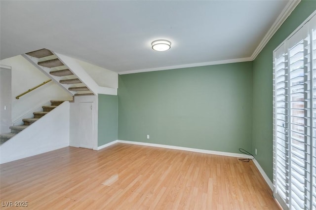516 Delfern Ln, Las Vegas, NV 89169 - unfurnished living room with wood finished floors, crown molding, stairs, and baseboards