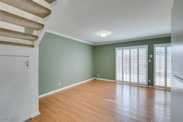 516 Delfern Ln, Las Vegas, NV 89169 - empty room featuring crown molding, wood finished floors, and baseboards