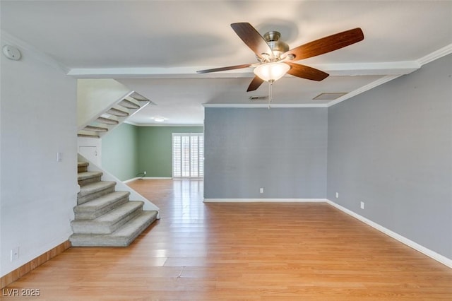 516 Delfern Ln, Las Vegas, NV 89169 - unfurnished room with stairway, light wood-style flooring, ceiling fan, crown molding, and baseboards