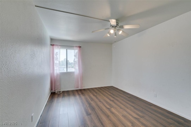 516 Delfern Ln, Las Vegas, NV 89169 - unfurnished room featuring wood finished floors, a ceiling fan, and baseboards