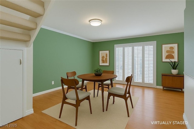 516 Delfern Ln, Las Vegas, NV 89169 - dining area with crown molding, light wood-type flooring, and baseboards