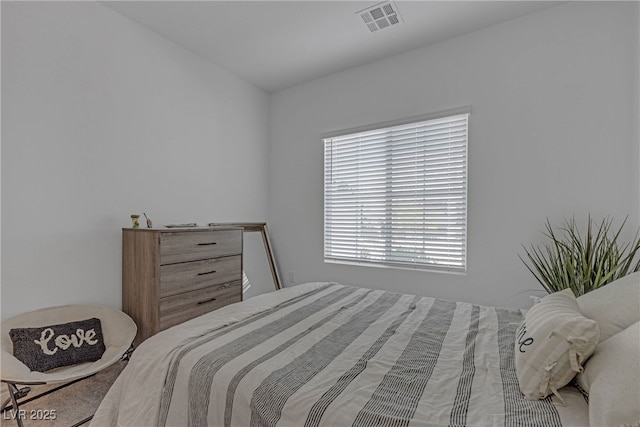 bedroom featuring visible vents