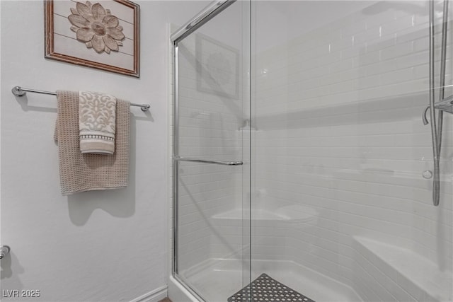 full bath with a shower stall