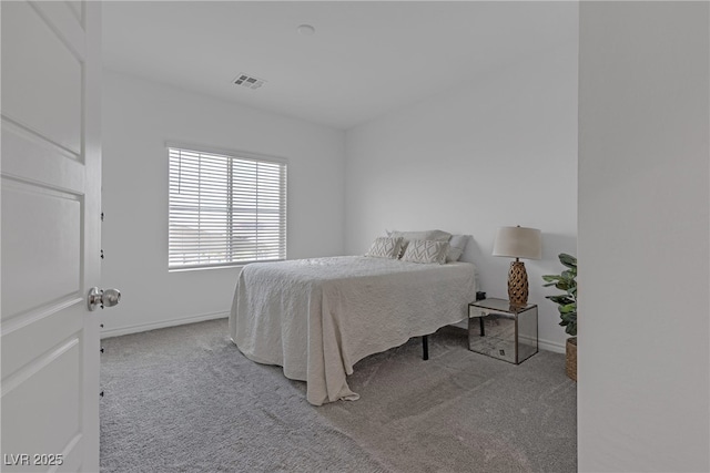 bedroom with baseboards, carpet, and visible vents