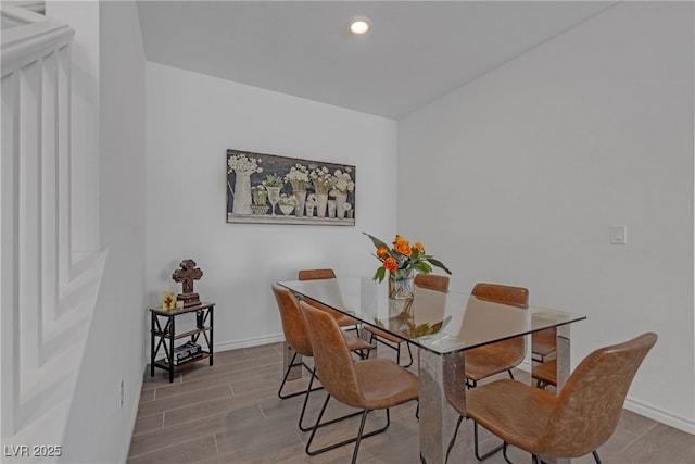 dining area featuring baseboards, recessed lighting, and wood finished floors