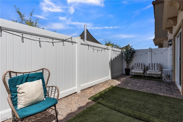 view of yard with a fenced backyard and a patio