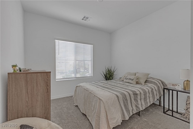bedroom featuring baseboards, carpet, and visible vents