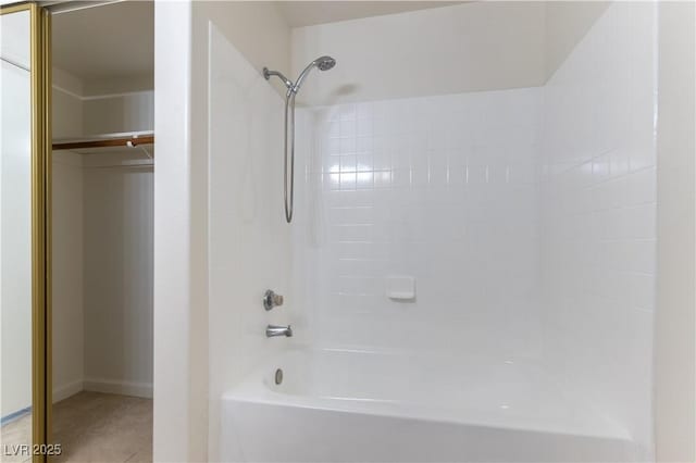 full bath with tile patterned flooring, baseboards, and shower / bathtub combination