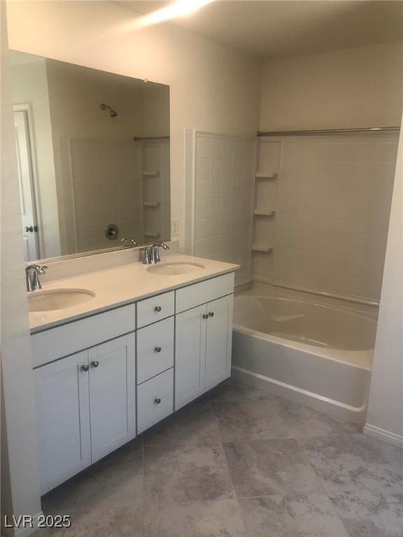 3270 Trabia Ave, Henderson, NV 89044 - full bathroom featuring double vanity, a sink, and shower / bath combination