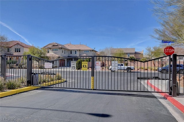 view of gate with a residential view