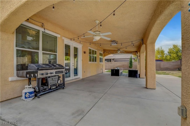 view of patio / terrace with french doors, ceiling fan, a grill, and a fenced backyard