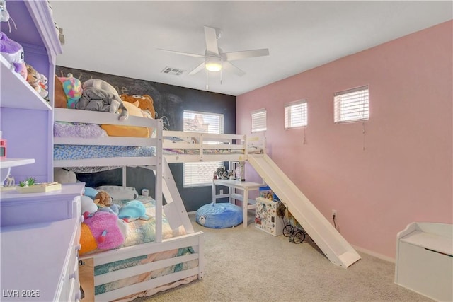bedroom with visible vents, carpet, and ceiling fan