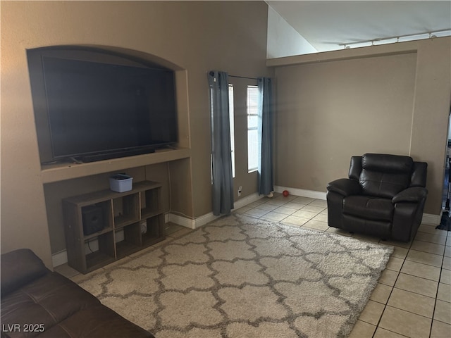 tiled living room featuring baseboards