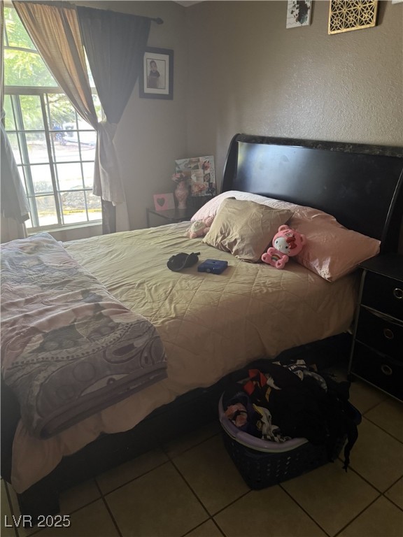 bedroom featuring tile patterned flooring