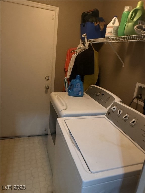 washroom with light floors, laundry area, and independent washer and dryer
