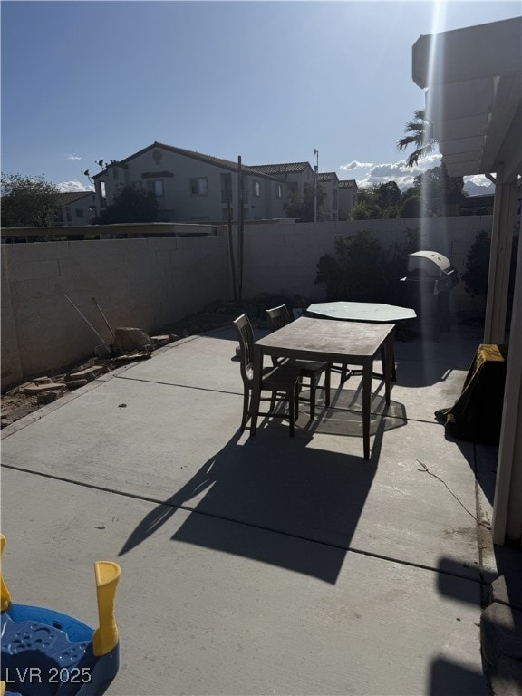 view of patio / terrace with outdoor dining space and a fenced backyard