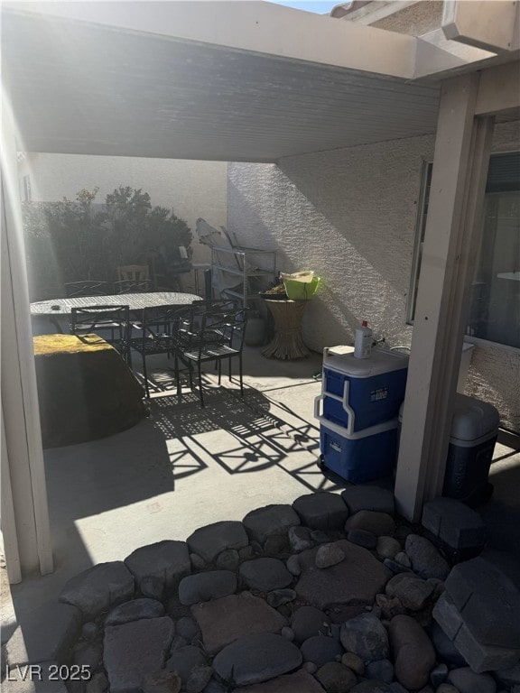view of patio featuring outdoor dining area
