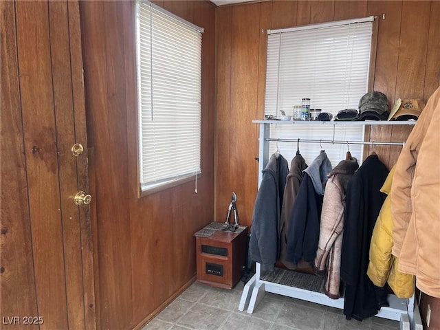 mudroom with wood walls