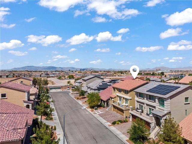 aerial view featuring a mountain view and a residential view