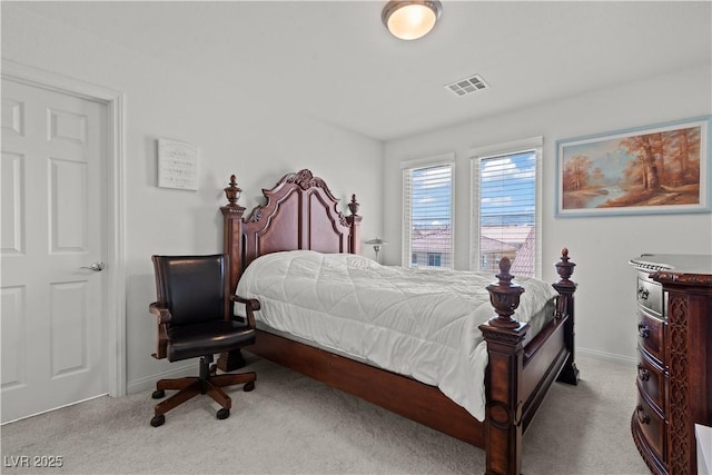 bedroom with carpet floors, baseboards, and visible vents
