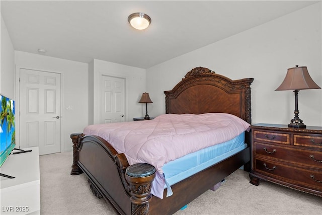 bedroom featuring light colored carpet
