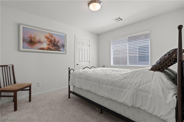 carpeted bedroom featuring baseboards and visible vents
