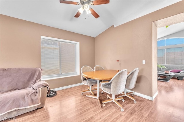 2753 Trickling Brook Ct, Las Vegas, NV 89156 - dining room featuring vaulted ceiling, baseboards, light wood-style floors, and ceiling fan