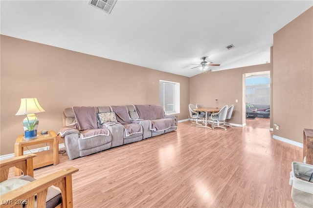 2753 Trickling Brook Ct, Las Vegas, NV 89156 - living room featuring a ceiling fan, light wood-style flooring, and baseboards
