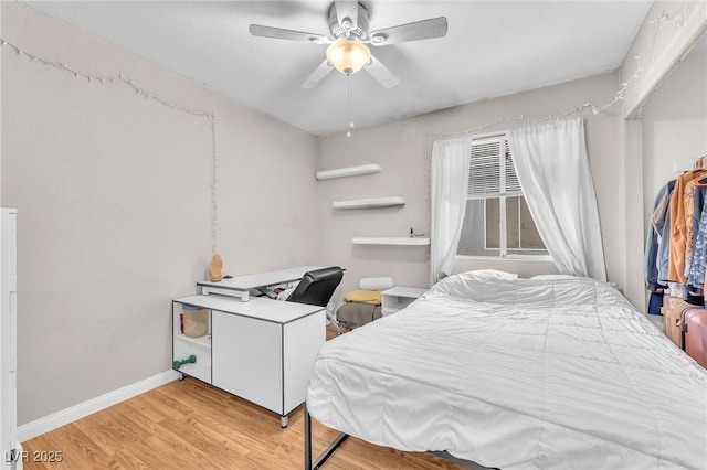 2753 Trickling Brook Ct, Las Vegas, NV 89156 - bedroom featuring light wood-style flooring, a ceiling fan, and baseboards