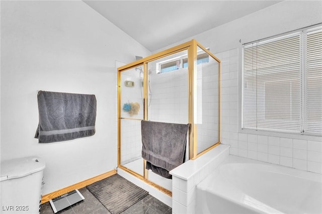 2753 Trickling Brook Ct, Las Vegas, NV 89156 - full bathroom featuring a garden tub, a stall shower, toilet, and baseboards