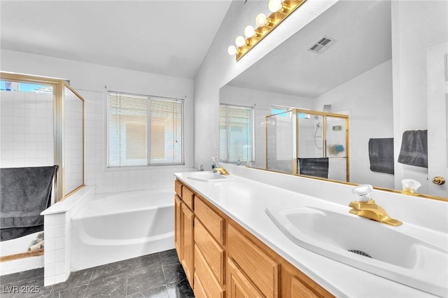 2753 Trickling Brook Ct, Las Vegas, NV 89156 - full bathroom featuring a shower stall, a garden tub, double vanity, and healthy amount of natural light